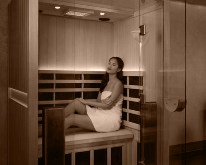 Woman relaxing in a sauna